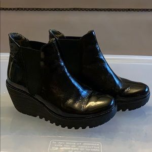 Black patent leather Fly London booties
